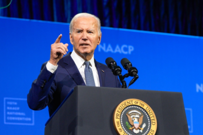 President Joe Biden delivering a speech at a podium with the presidential seal, reflecting his farewell address and his tenure as the 46th President of the United States