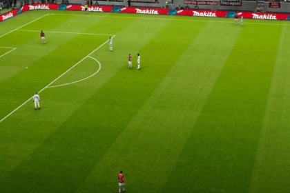 An expansive view of a lush green football pitch at the San Siro Stadium, capturing the atmosphere of an intense Serie A clash between AC Milan and Parma.