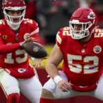 Generate or add a meaningful description of the image, such as "Kansas City Chiefs players in action during an NFL game.