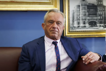 Robert F. Kennedy Jr. sitting in an interview setting, discussing political matters.