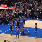 Shai Gilgeous-Alexander in action during an NBA game, showcasing his elite basketball skills.