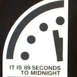 A symbolic representation of the Doomsday Clock set at 89 seconds to midnight, indicating the closest humanity has ever been to global disaster due to nuclear threats, climate change, and technological risks.