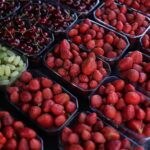 Fresh strawberries in baskets displayed at a market