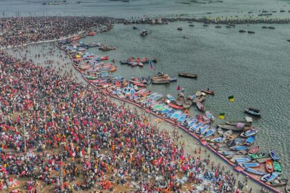 A breathtaking aerial view of the Maha Kumbh Mela at Triveni Sangam, showing millions of devotees gathered for the sacred ritual bath.