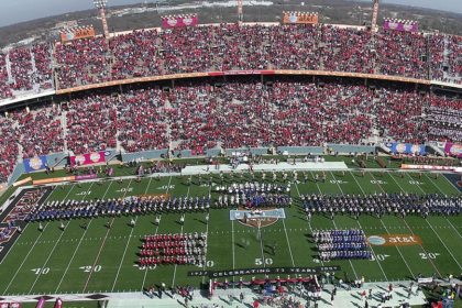 A packed AT&T Stadium in Arlington, Texas, during the Cotton Bowl Classic, showcasing a vibrant college football atmosphere