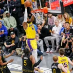 Los Angeles Lakers players in action during an intense NBA game, showcasing their dominance on the court.