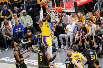 Los Angeles Lakers players in action during an intense NBA game, showcasing their dominance on the court.