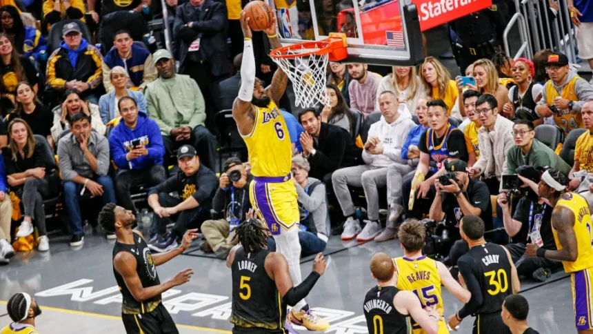 Los Angeles Lakers players in action during an intense NBA game, showcasing their dominance on the court.