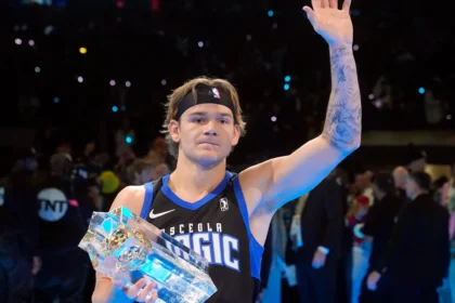 Mac McClung celebrates after winning his third consecutive NBA Slam Dunk Contest at the 2025 All-Star Weekend.