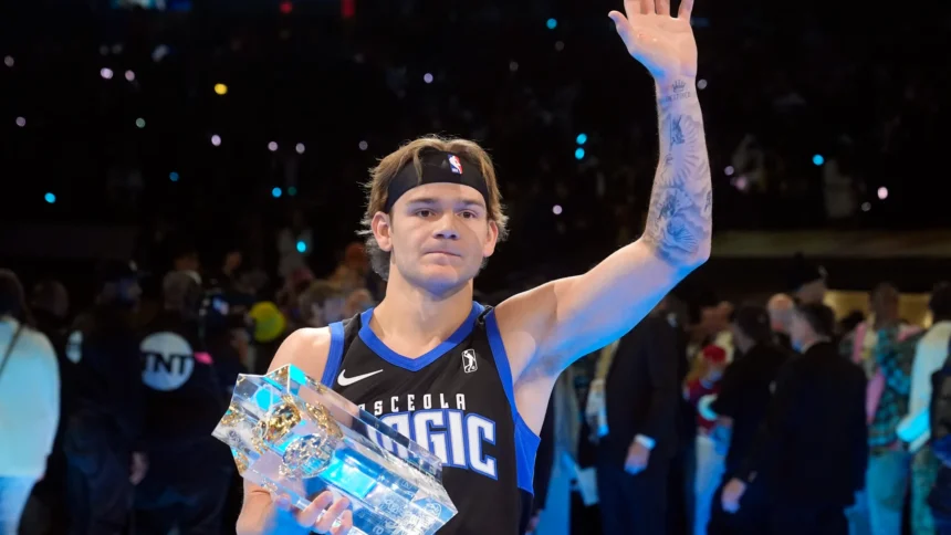 Mac McClung celebrates after winning his third consecutive NBA Slam Dunk Contest at the 2025 All-Star Weekend.