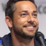 Zachary Levi speaking at a press event, discussing his upcoming film The Unbreakable Boy and addressing political corruption in Hollywood