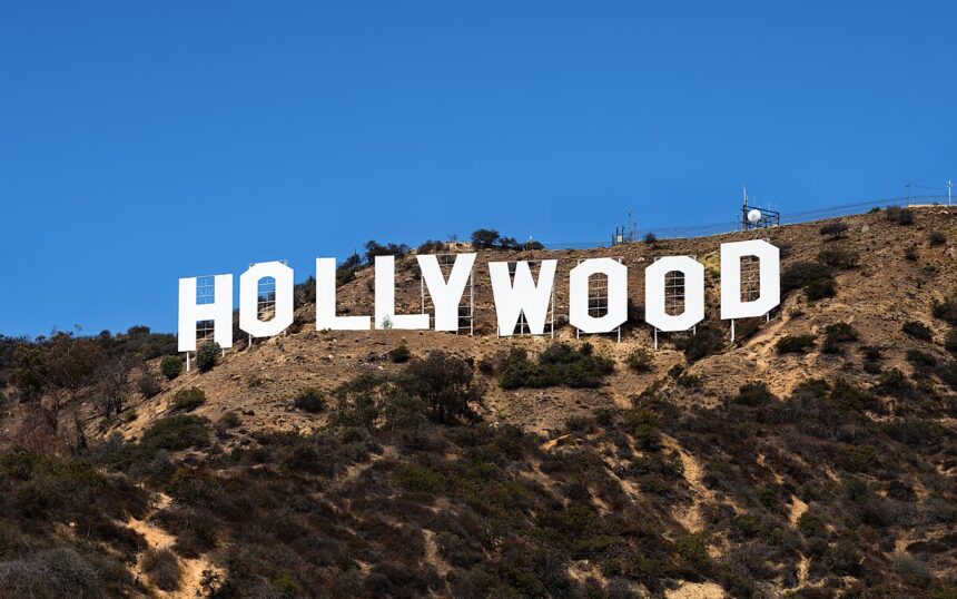 The iconic Hollywood sign in Los Angeles, symbolizing the entertainment industry's ongoing power struggles and the impact on major film productions in 2025.