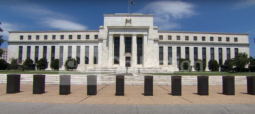 Federal Reserve building with a clear blue sky in the background.