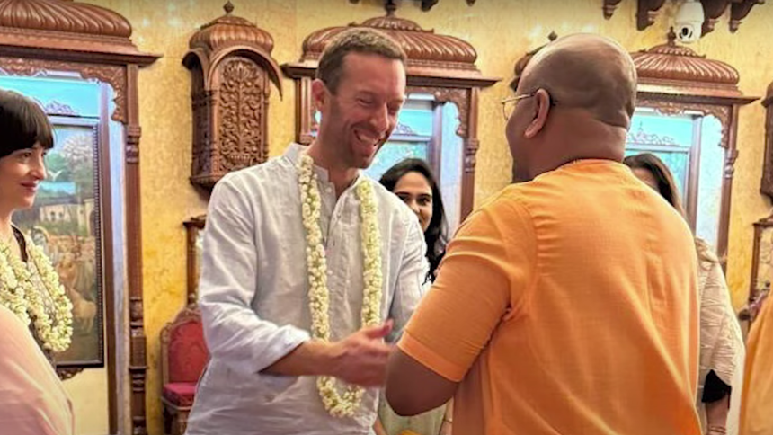 Chris Martin participating in the Mahakumbh 2025, engaging in spiritual discussions with Hindu monks.