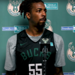 Delon Wright in a Milwaukee Bucks jersey at a press conference before being traded to the New York Knicks in a pre-trade deadline deal.