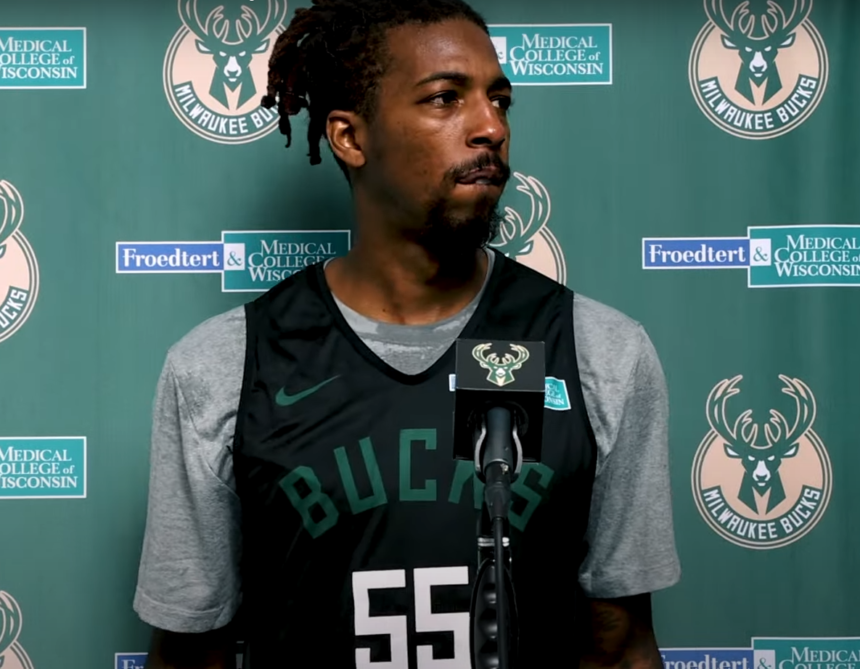 Delon Wright in a Milwaukee Bucks jersey at a press conference before being traded to the New York Knicks in a pre-trade deadline deal.