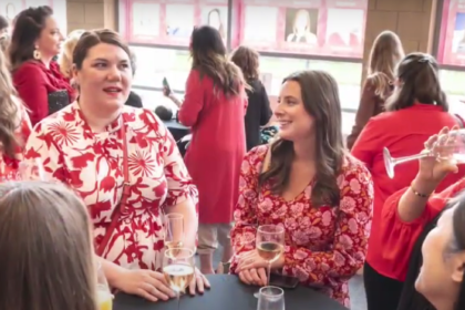 Women dressed in red celebrating National Wear Red Day 2025 to raise awareness for heart disease prevention.