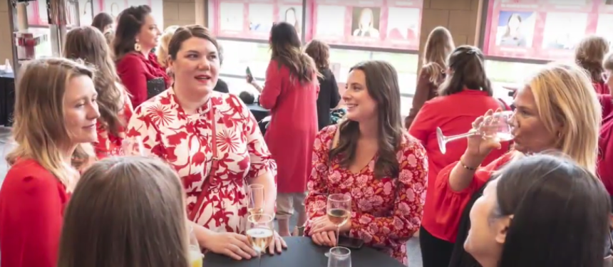 Women dressed in red celebrating National Wear Red Day 2025 to raise awareness for heart disease prevention.