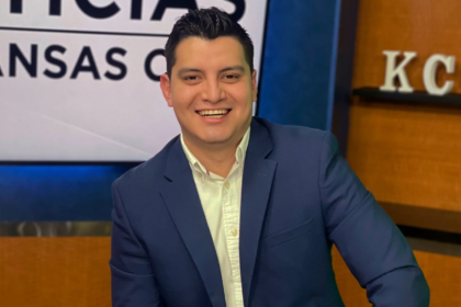 Adan Manzano, a Telemundo sports journalist, smiling in a studio setting.