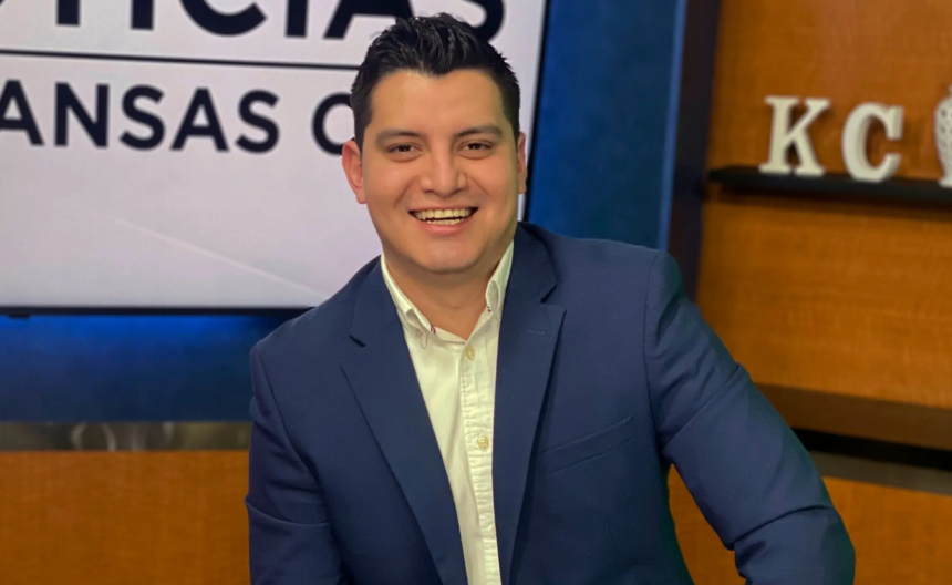 Adan Manzano, a Telemundo sports journalist, smiling in a studio setting.