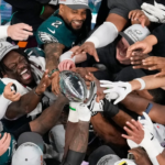 Philadelphia Eagles players celebrate their Super Bowl 59 victory, lifting the Vince Lombardi Trophy after defeating the Kansas City Chiefs.