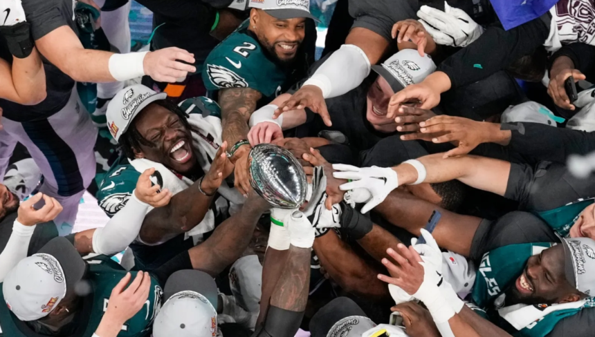 Philadelphia Eagles players celebrate their Super Bowl 59 victory, lifting the Vince Lombardi Trophy after defeating the Kansas City Chiefs.