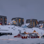 Snow-covered cityscape in Greenland during winter.