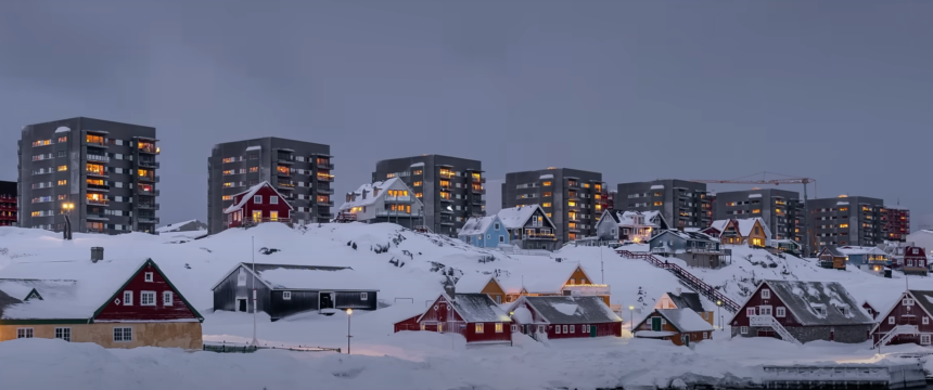 Snow-covered cityscape in Greenland during winter.