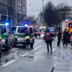 Emergency response at the scene of a car attack in Munich, Germany, with police securing the area.