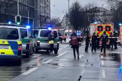 Emergency response at the scene of a car attack in Munich, Germany, with police securing the area.