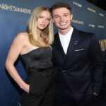 Patrick Schwarzenegger and Abby Champion attending a red carpet event, smiling together.