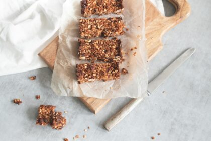 A stack of granola bars on parchment paper, representing the recent FDA recall due to contamination concerns.