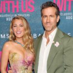 Blake Lively and Ryan Reynolds pose together at a red carpet event, representing their Hollywood success and billion-dollar business empire.